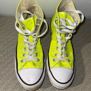 Neon yellow high tops converse